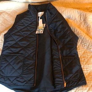 Blue puffy vest, Market Spruce